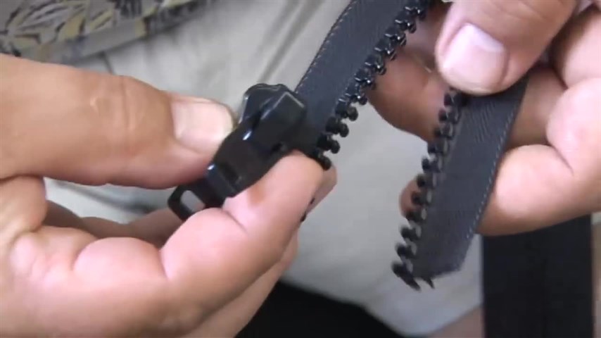 sửa dây khóa kéo bị mất con chặn dưới